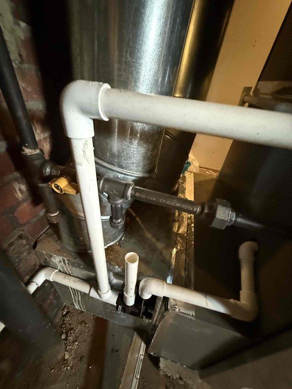 Completed installation of a 2.5-ton, 15.5 SEER complete HVAC system with 97% efficiency upflow furnace and 50-gallon electric water heater. System includes new ductwork, PVC exhaust venting, and all necessary plumbing connections as documented in photos.