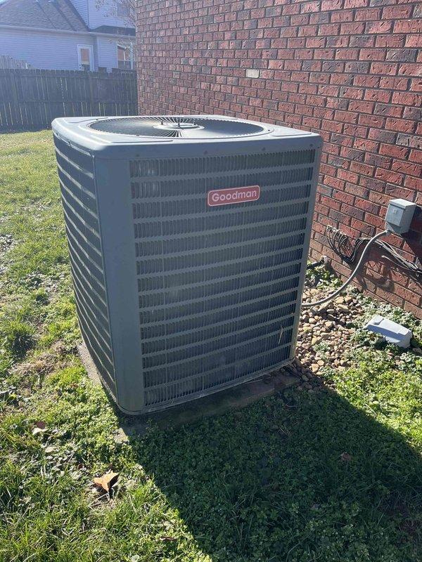 Performed annual Gold Level maintenance on customer's 5-year-old Goodman HVAC system. Inspected outdoor condenser unit and verified proper operation. Checked Honeywell thermostat functionality, confirming emergency heat mode operation with current temperature reading of 68°F against set point of 66°F and auto fan setting.