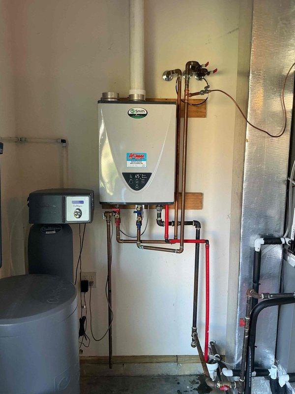 Performed scheduled maintenance service on A.O. Smith tankless water heater as part of USA Bronze Tankless Maintenance Plan. Completed full system flush to remove mineral buildup and sediment, ensuring optimal heating efficiency and extended equipment lifespan. Inspected all connections, valves, and control components - system functioning properly with no issues detected.