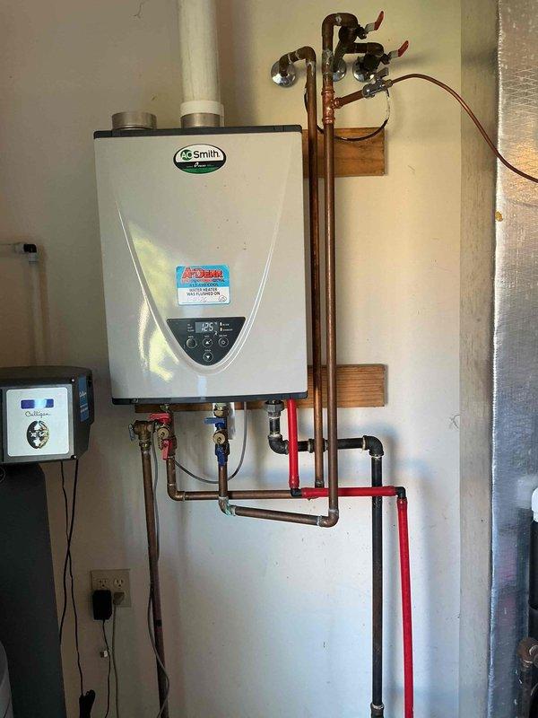 Performed scheduled maintenance service on A.O. Smith tankless water heater as part of USA Bronze Tankless Maintenance Plan. Completed full system flush to remove mineral buildup and sediment, ensuring optimal heating efficiency and extended equipment lifespan. Inspected all connections, valves, and control components - system functioning properly with no issues detected.
