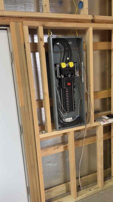 Completed site assessment for mini-split installation in client's pole barn. Surveyed unfinished space featuring concrete flooring, metal ceiling, and partial wood framing. Inspected existing electrical panel to evaluate capacity for supporting new HVAC system. Client discovered our services through Google and is seeking options for climate control in their outbuilding.