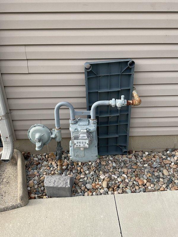 Conducted generator installation estimate at residential property, evaluating existing 200A Cutler-Hammer electrical panel and natural gas meter setup. Determined adequate electrical capacity and gas supply for proposed generator installation. Photos documented current infrastructure to facilitate accurate quote preparation.