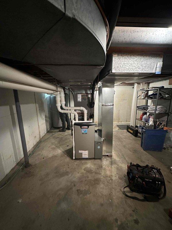 Completed installation of a 3-ton Lennox HVAC complete system in a downstairs/basement location. Installed new outdoor condenser unit on concrete pad with proper line connections to the home. Set up interior furnace unit with PVC ventilation pipes and connected to existing ductwork in the utility area.