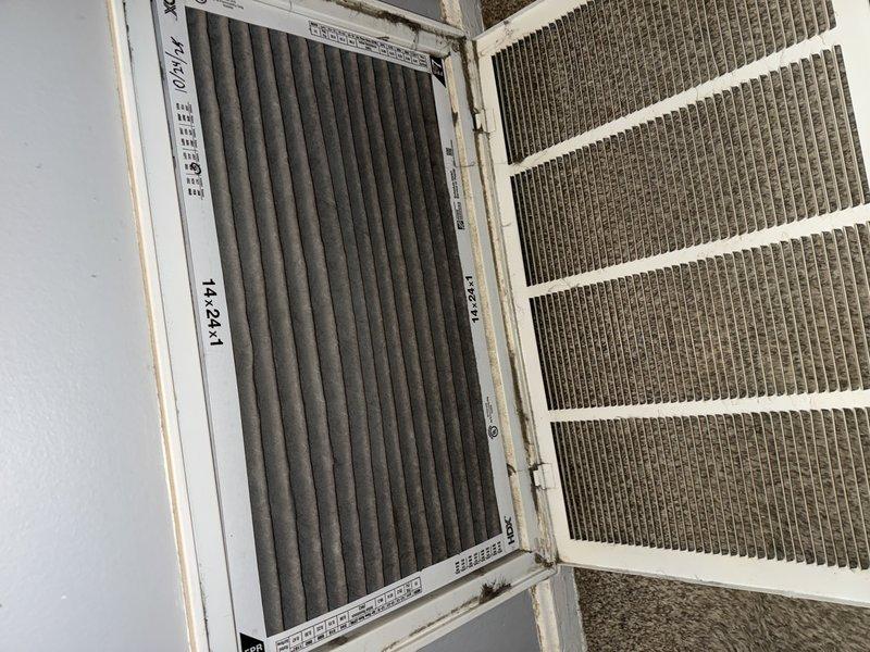Responded to no-heat call for 10+ year old system with no airflow. Diagnostic inspection revealed severely clogged air filters (both pleated carbon filter and standard mesh filter) restricting proper airflow. Replaced filters and performed system reset, restoring normal heating operation and proper airflow through vents.