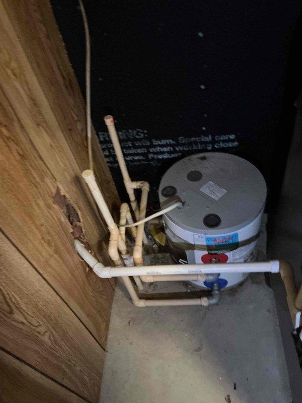 Performed a comprehensive flush on a tanked water heater system to remove sediment buildup. Inspected all plumbing connections, including PVC pipes and brass fittings, ensuring proper sealing at junction points. System was returned to full operational status with improved efficiency and extended equipment lifespan.