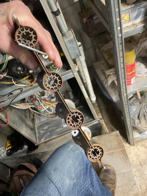 Performed annual maintenance on 12-year-old HVAC system as requested. Inspected mechanical components including gear assembly and linkage system. Conducted electrical diagnostics with multimeter, recording AC voltage measurement of 0.36V at equipment housing. Replaced standard 16x25x4+1" filter as part of scheduled service.