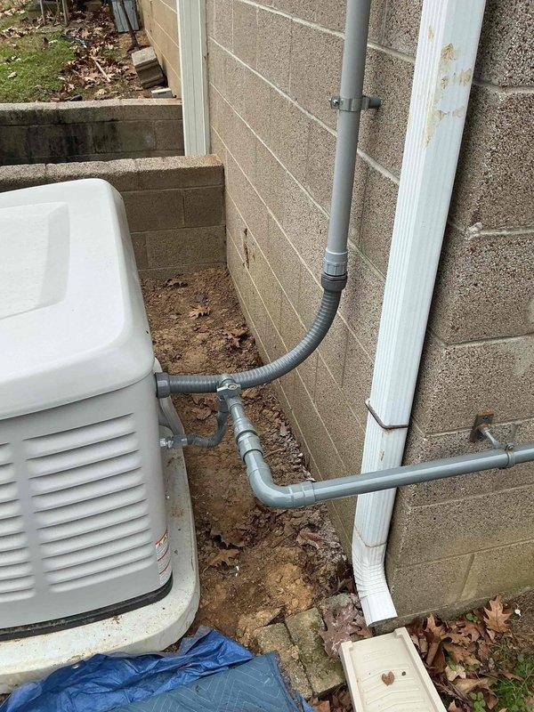 Completed follow-up electrical service for transfer switch installation. Routed and secured conduit connections between generator unit and building structure. Coordinated with local inspector for final approval and inspection completion.