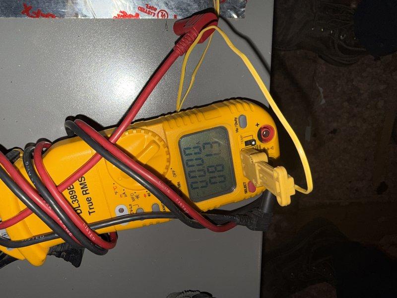 Responded to callback for insufficient cooling issue after previous service on 1/15. Conducted electrical diagnostics using multimeter to verify system parameters. Customer experiencing 56°F indoor temperature despite filter replacement during prior visit. Technician different from previous service call as requested by customer.