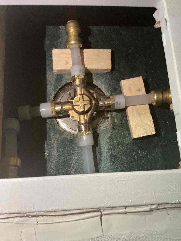 Responded to follow-up call regarding persistent hissing sound from master bath shower. Inspected valve assembly through access panel and confirmed diagnosis from previous visit. Replaced faulty cartridge in valve body which was causing the noise issue, as the original assessment had indicated no leaks within the wall cavity.