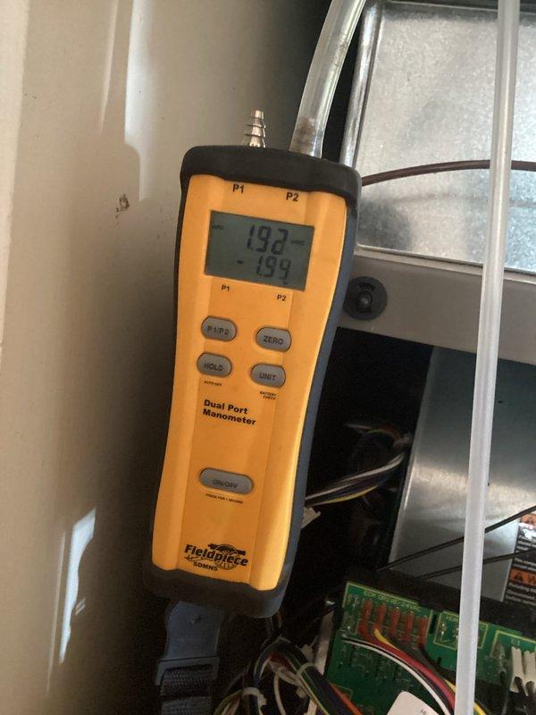 Performed diagnostic assessment on customer's fully modulating HVAC system that was reported to short-cycle and inadequately remove humidity. Conducted pressure testing with dual port manometer (readings: 193/-194) and inspected control board connections. Reattached fallen return air duct in attic and verified proper system operation after adjustments.