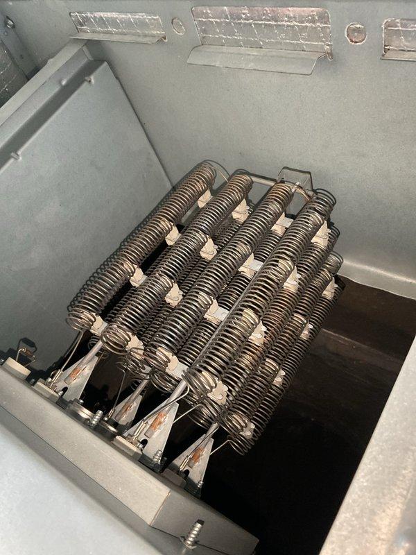 Diagnosed 4-year-old non-functioning system with blank thermostat and flashing furnace lights. Discovered failed contactor (CONT2P040024V) in electric heating unit preventing proper operation. Replaced contactor, reset system breakers, and verified proper heating function with adequate airflow through vents.