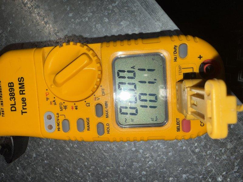 Attempted scheduled maintenance on 1-year-old CFI system but customer was not present. Used UEi DL389B True RMS multimeter to perform preliminary electrical diagnostics before discovering customer unavailability. Left message for customer to reschedule second maintenance visit.