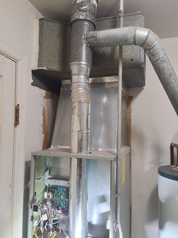 Performed diagnostic assessment on 5-7 year old furnace system responding to customer concerns. Opened access panel to inspect circuit board and electrical connections, utilizing clamp meter to test wiring integrity and component functionality. System was operational during visit with adequate airflow through vents, and no immediate critical issues were identified requiring repair.