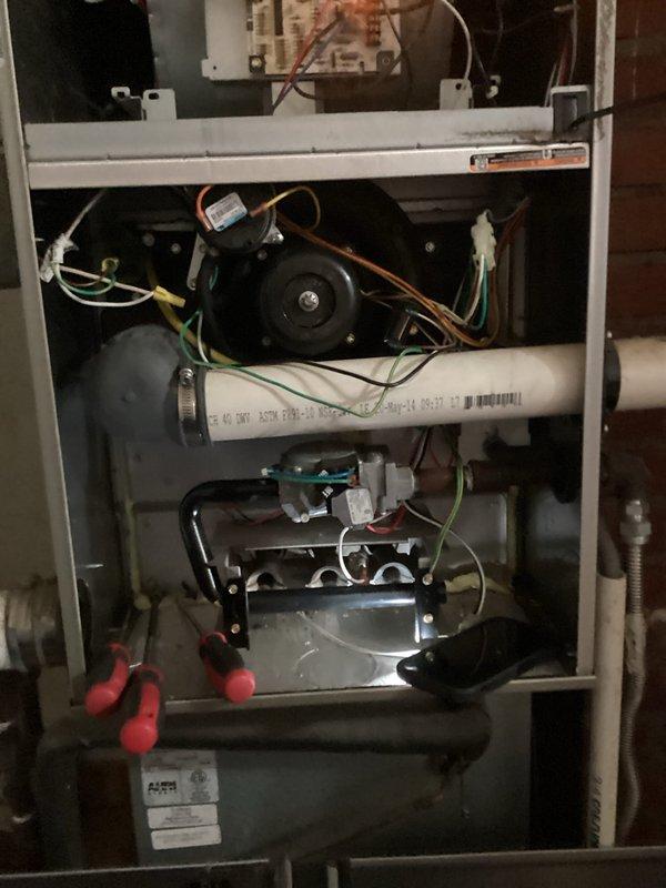 Responded to service call for intermittent heating issue on system approximately 5-10 years old. Diagnosed short-cycling furnace blowing room temperature air. Inspection revealed significant dust accumulation on internal components and flame sensor. Cleaned flame sensor, inspected burner assembly, and verified proper ignition sequence. System now operating correctly with consistent heat output.