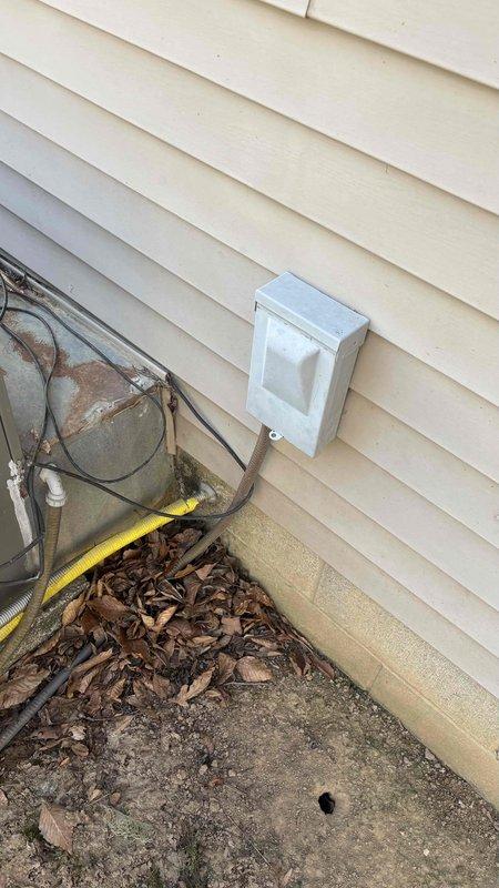 Conducted comprehensive HVAC replacement estimate for customer looking to convert from gas to electric system with increased capacity. Inspection revealed existing installation in confined wooden structure with potential ductwork modifications required. Evaluated exterior electrical connections and junction box mounted on vinyl siding for compatibility with proposed system upgrade.