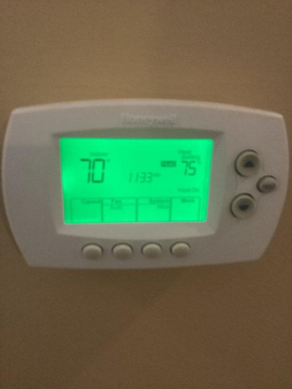 Performed routine maintenance on 7-year-old HVAC system during second scheduled visit. Inspected and verified proper operation of both Honeywell THM5320R wireless thermostat and standard digital thermostat. System maintaining appropriate temperature differential with set point at 75°F and current temperature reading at 70°F. Replaced 16x25x5 filter as part of regular maintenance protocol.