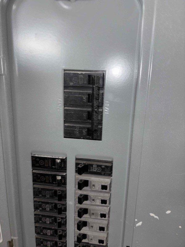 Conducted site assessment for propane generator installation, evaluating existing electrical infrastructure including 200A service panel with approximately 20-24 circuit breakers. Customer requires generator estimate for backup power system and previously inquired about HVAC solutions for two bedrooms. Documented panel configuration and load distribution to determine appropriate generator sizing and transfer switch requirements.