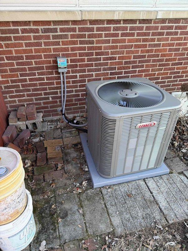 Successfully completed installation of a complete 2.5-ton, 15.5 SEER Lennox HVAC system with 97% efficiency furnace. System includes new indoor furnace unit with PVC venting and outdoor condensing unit properly secured on concrete pad with electrical connections to junction box.