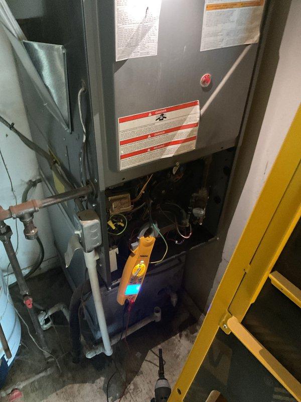 Responded to service call for 6-year-old dual-system HVAC unit where downstairs unit was automatically switching from heat to cooling mode without user input. Diagnostic testing revealed significant corrosion and deterioration at connection points, particularly at the control board junction. Repaired damaged wiring connections and replaced corroded terminals to restore proper thermostat communication, successfully resolving the mode-switching issue.
