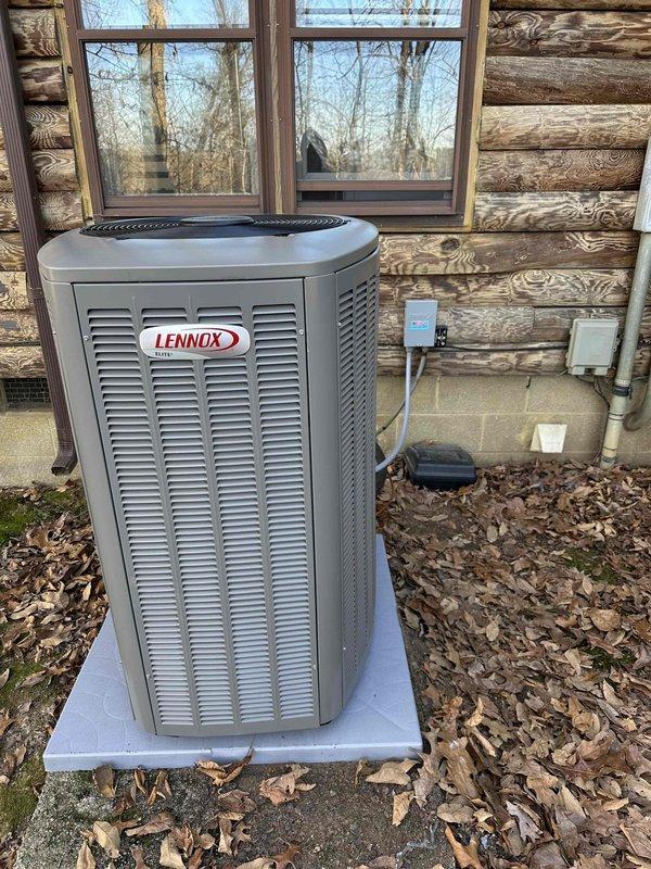 Successfully installed a complete 2-ton, 18 SEER Lennox HVAC system at a log cabin-style residence. The outdoor condensing unit was properly positioned on a concrete pad with appropriate electrical connections and disconnect box. Indoor installation included furnace unit with PVC ventilation system in the utility room, completing the full system replacement as specified in the sales order.