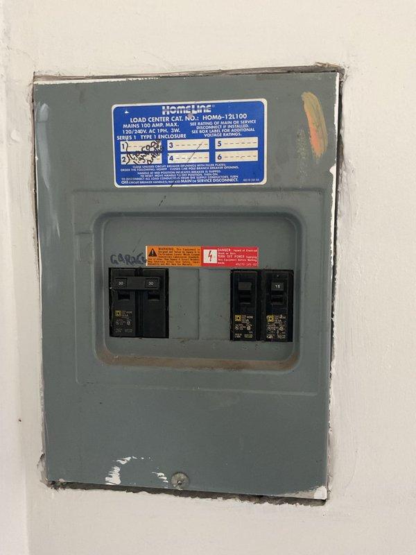 Conducted site assessment for mini-split installation in upstairs area per customer request. Evaluated electrical service panel (HomeLine LOAD CENTER CAT. NO.: HOM4-12L100) to determine compatibility with proposed system. Inspected potential indoor unit location in bedroom with adequate wall space and proper clearance for optimal airflow and efficiency.