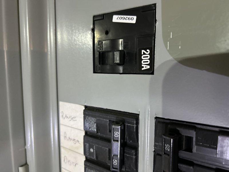 Conducted comprehensive evaluation of residential electrical system for potential generator installation. Inspected 200A main breaker panel with natural gas availability, documenting current circuit configuration and load distribution to determine appropriate generator sizing and connection requirements. Panel appears in good working condition with adequate capacity for generator integration.