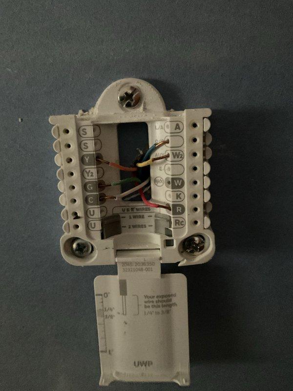 Performed comprehensive assessment of 50-year-old HVAC system for potential replacement. Inspected existing thermostat wiring configuration, documenting connection points and wire placement. Evaluated electrical panel to confirm adequate power supply for new system installation, noting the existing 60-amp furnace circuit and air conditioning connections. Customer expressed interest in tankless water heater promotion and indicated financing would be required for the project.