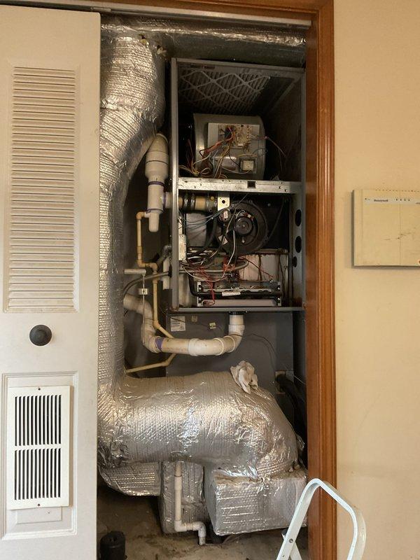 Responded to no heat call for 20-year-old Arcoaire gas furnace that was short cycling and blowing cool air. Upon inspection, found significant corrosion on heat exchanger and deterioration of blower assembly components. Diagnosed failed pressure switch and compromised heat exchanger requiring full system replacement. Temporarily restored operation by cleaning contacts and adjusting pressure switch to allow customer time to consider replacement options. Recommended immediate upgrade due to safety concerns and inefficiency of current system.