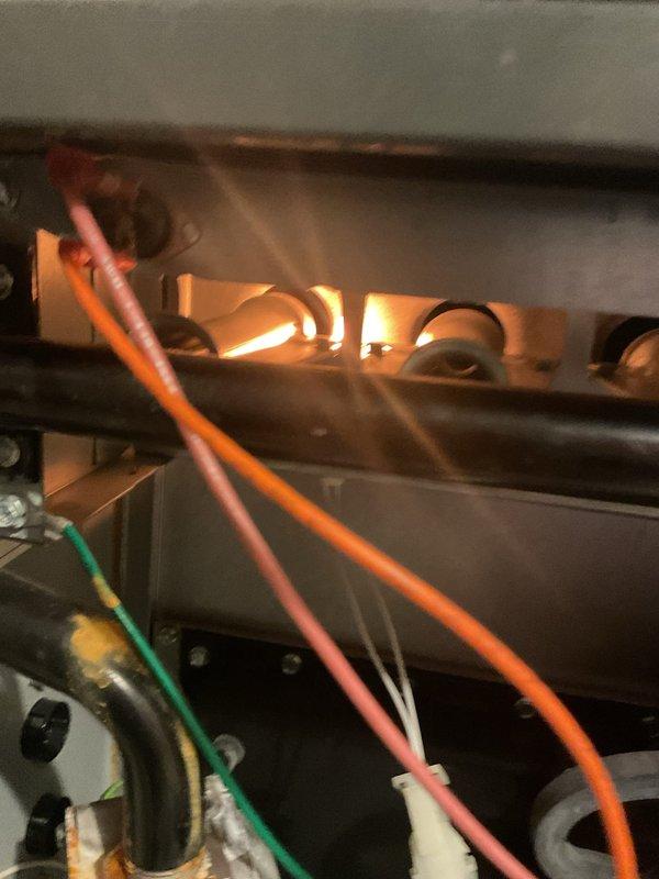 Upon arrival, diagnosed intermittent heating issue persisting after previous flame sensor replacement. Observed proper burner ignition with consistent blue flames but system continued to cycle off prematurely. Identified faulty pressure switch causing improper operation. Replaced pressure switch, verified proper system operation through multiple heating cycles, and confirmed normal flame pattern and gas combustion.
