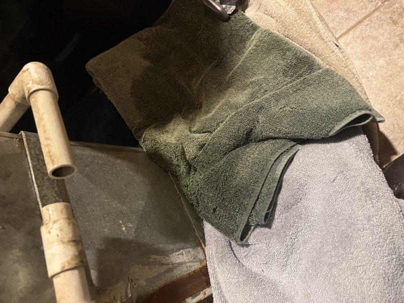 Responded to no-heat call with indoor temperature at 54°F. Discovered condensate drain line was clogged, causing the safety switch to disable the heating system. Cleared blockage in drain line and removed accumulated moisture from drain pan. System tested and confirmed to be operating properly with normal airflow restored.