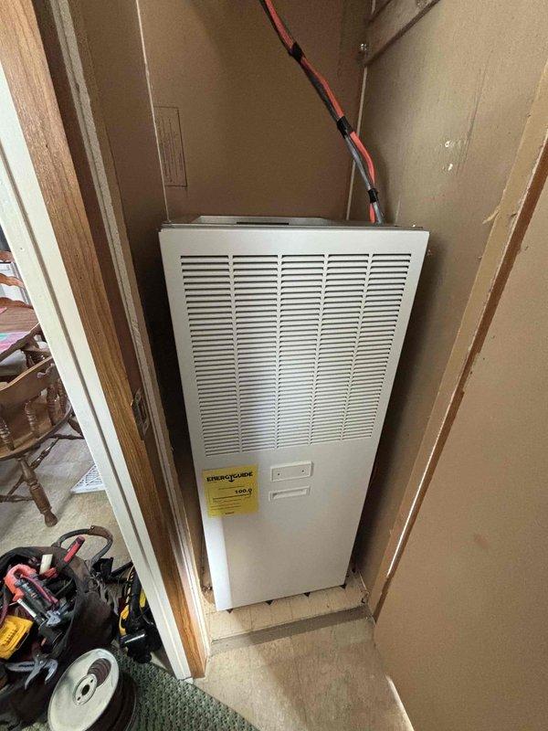 Completed installation of air handler in residential closet space. Performed comprehensive testing with digital measurement device, obtaining readings of 694 on filter media. All electrical connections were properly secured with proper wire routing along the wall structure.