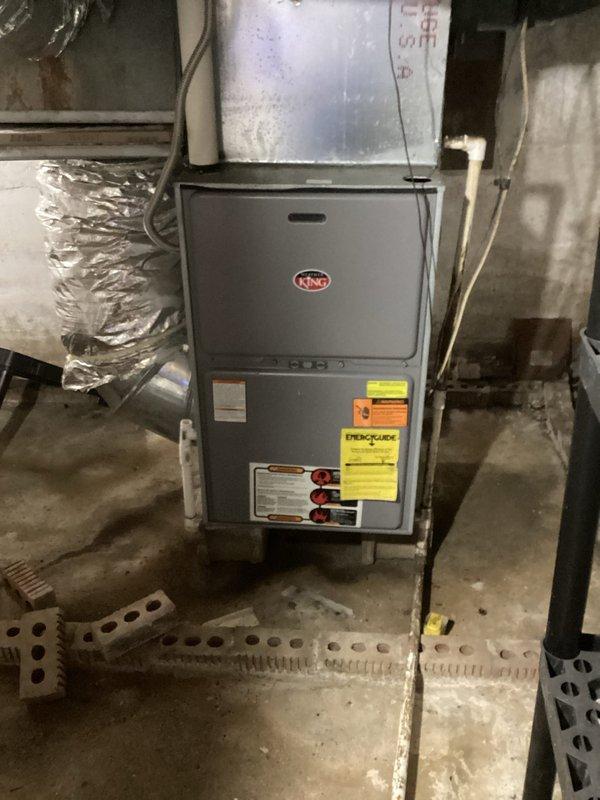 Performed annual maintenance on 1-year-old Ruud HVAC system (2nd visit of Gold Level plan). Inspected furnace installation and connections in utility area, including ductwork and drainage. Examined electrical panel and fuse components for proper operation. System functioning correctly; recommended filter replacement and renewal of maintenance plan.