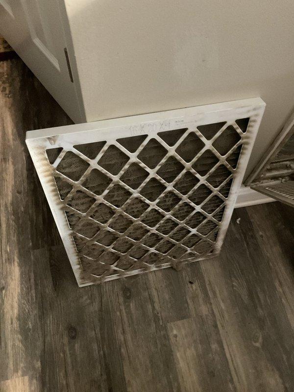 Responded to no-heat call for aging system (10+ years). Diagnostic inspection revealed severely clogged air filter with significant dust and debris accumulation, restricting proper airflow. Removed and replaced filter to restore system efficiency and proper heating function.