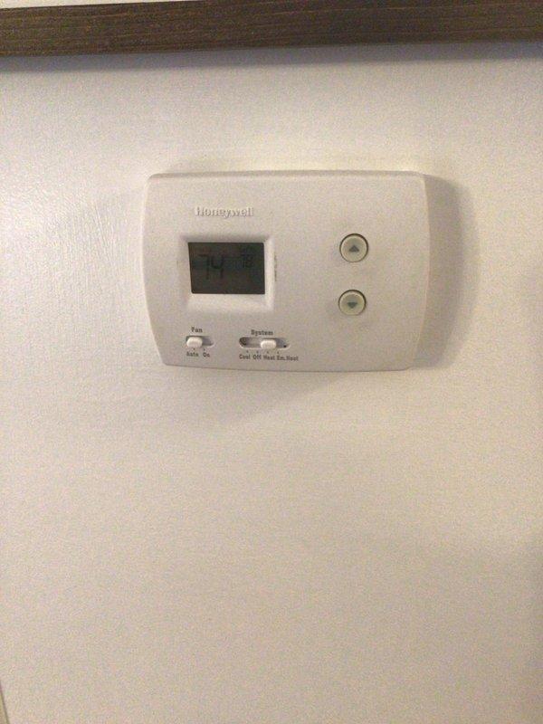 Performed Gold Level maintenance service on 5-year-old residential HVAC system. Inspected Honeywell thermostat operation and verified temperature readings. Examined outdoor condenser unit, which was properly mounted on concrete pad with adequate clearance, despite snow conditions. Replaced air filter as part of annual maintenance protocol.