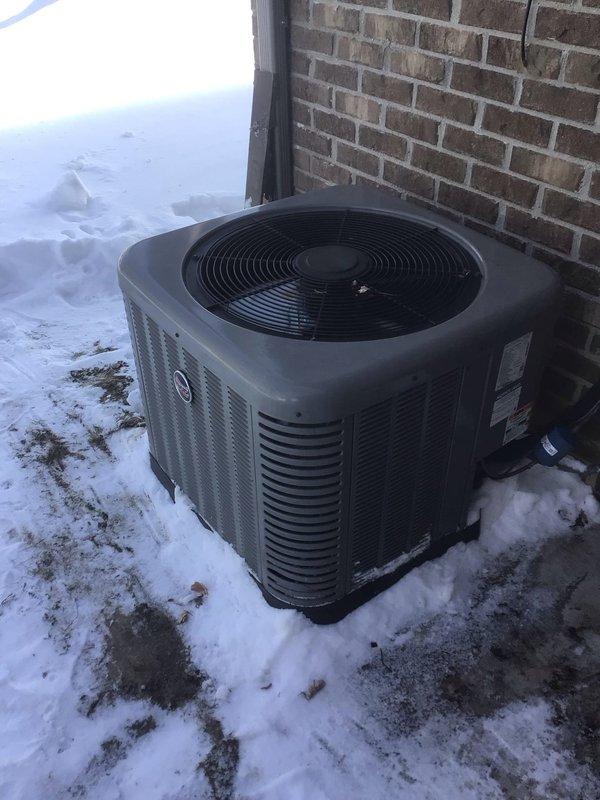 Performed Gold Level maintenance service on 5-year-old residential HVAC system. Inspected Honeywell thermostat operation and verified temperature readings. Examined outdoor condenser unit, which was properly mounted on concrete pad with adequate clearance, despite snow conditions. Replaced air filter as part of annual maintenance protocol.