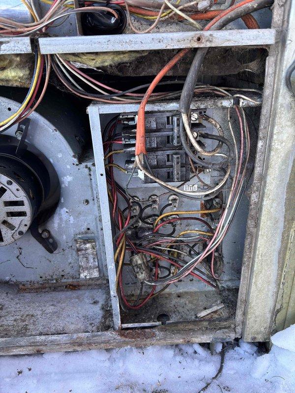 Serviced 18-year-old heating system that was failing to reach set temperature. Upon inspection, found significant dust and debris accumulation within the electrical panel and circuit board. Cleaned electrical connections and verified proper voltage to components. System now heating effectively with improved airflow and temperature regulation.