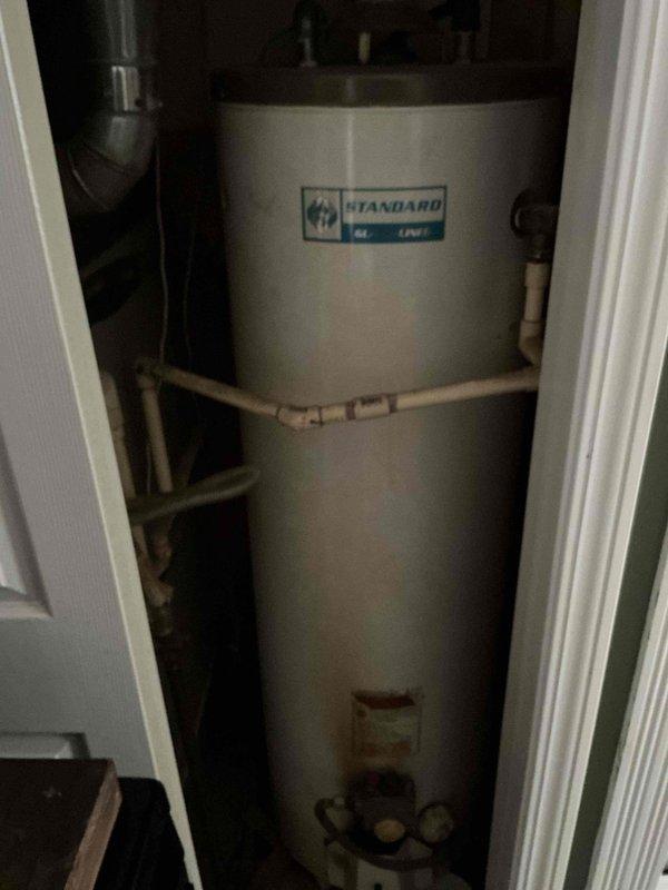 Conducted comprehensive assessment of existing 40-gallon electric water heater located in utility closet. Evaluated current installation conditions, noting available gas service in home that could be utilized for potential replacement options. Discussed both tank and tankless replacement options with customer, accommodating their 3rd shift work schedule requirements.
