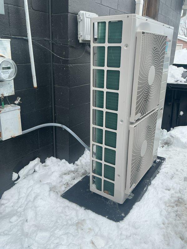Performed annual Gold Level maintenance on a mini-split system (installed 7/2025). Inspected two outdoor condenser units which showed significant snow accumulation around bases that could restrict proper airflow. Cleared snow from units and surrounding area to ensure adequate ventilation. System functioning properly after service; recommended maintaining clear perimeter around outdoor units during winter months.