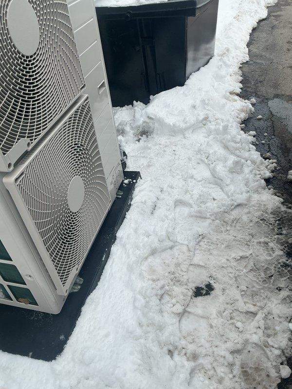Performed annual Gold Level maintenance on a mini-split system (installed 7/2025). Inspected two outdoor condenser units which showed significant snow accumulation around bases that could restrict proper airflow. Cleared snow from units and surrounding area to ensure adequate ventilation. System functioning properly after service; recommended maintaining clear perimeter around outdoor units during winter months.