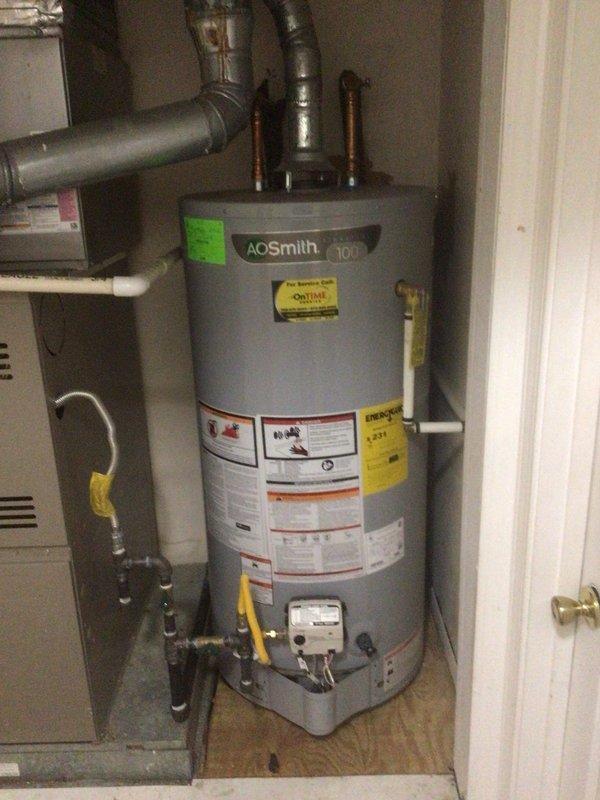 Performed scheduled maintenance on 8-year-old AC unit and 11-year-old furnace system during follow-up visit. Inspected A.O. Smith water heater connections and verified proper installation. Examined furnace ductwork, checking seals and connections, with particular attention to the 90-degree duct bend and reflective metallic tape sealing. Contacted customer (Robert) prior to arrival as requested.