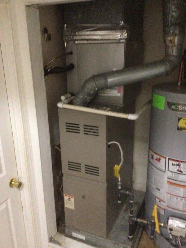 Performed scheduled maintenance on 8-year-old AC unit and 11-year-old furnace system during follow-up visit. Inspected A.O. Smith water heater connections and verified proper installation. Examined furnace ductwork, checking seals and connections, with particular attention to the 90-degree duct bend and reflective metallic tape sealing. Contacted customer (Robert) prior to arrival as requested.