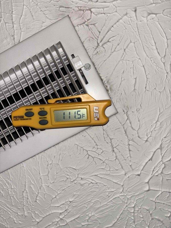 Responded to callback for continued no heat issue where system was not reaching setpoint of 72°F, stalling at 62°F with cold air from vents. Diagnostic testing revealed supply air temperature of 115°F at registers, confirming heat strip operation. Inspected control board and found loose wire connections at the terminal block which were causing intermittent auxiliary heat function. Reconnected and secured all wiring connections, verified proper operation with system now maintaining desired temperature.
