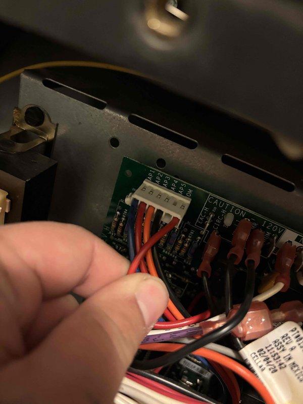 Responded to callback for continued no heat issue where system was not reaching setpoint of 72°F, stalling at 62°F with cold air from vents. Diagnostic testing revealed supply air temperature of 115°F at registers, confirming heat strip operation. Inspected control board and found loose wire connections at the terminal block which were causing intermittent auxiliary heat function. Reconnected and secured all wiring connections, verified proper operation with system now maintaining desired temperature.
