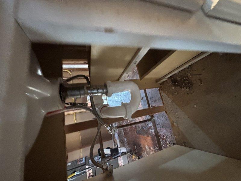 Completed installation of a RED tankless water heater system with associated plumbing components. Installed new sink, toilet, and faucet fixtures as specified in the service order. Work included connecting PEX supply lines with appropriate brass valves and fittings, and ensuring proper drainage through PVC waste lines with P-trap configuration. All installations were pressure tested and confirmed operational.