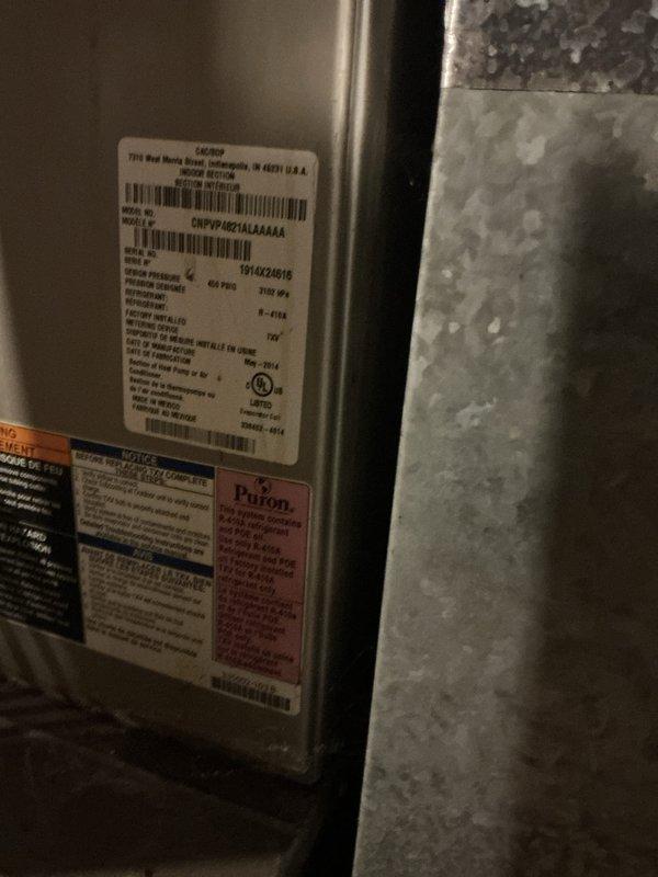 Performed scheduled monthly maintenance on 11-year-old HVAC system. Inspected equipment labels and specifications on unit manufactured in Indianapolis. Replaced 20x20x5 air filter and verified proper airflow direction through the system.