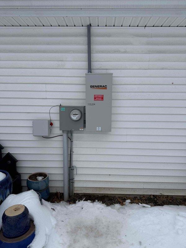 Performed follow-up service on Generac transfer switch system. Diagnosed need for replacement motorcycle battery in newer model generator. Inspected electrical connections at both the exterior transfer switch installation and interior circuit breaker panel to ensure proper integration. Customer's account is settled.