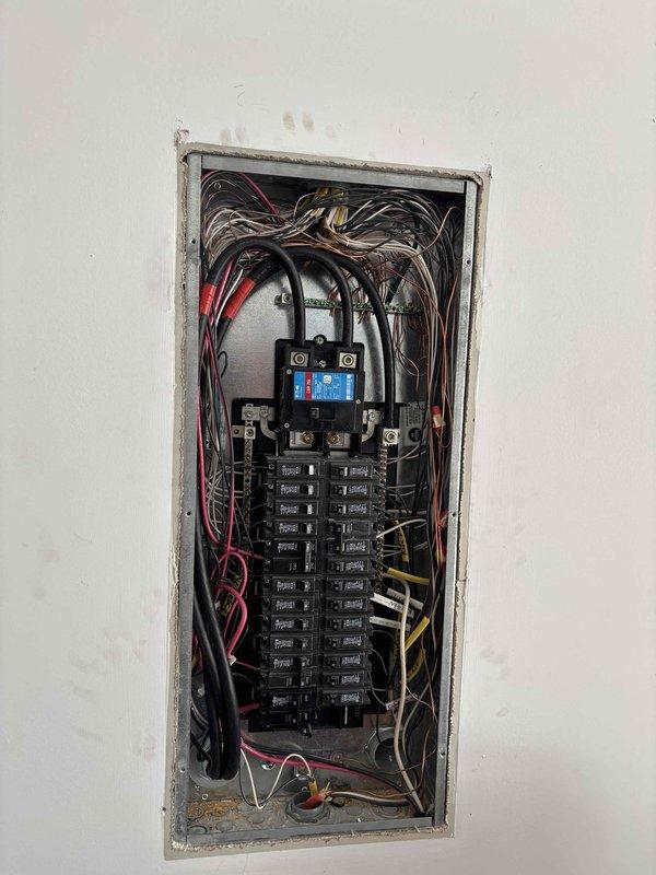 Performed follow-up service on Generac transfer switch system. Diagnosed need for replacement motorcycle battery in newer model generator. Inspected electrical connections at both the exterior transfer switch installation and interior circuit breaker panel to ensure proper integration. Customer's account is settled.
