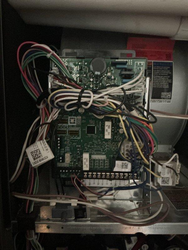 Completed follow-up service visit to inspect thermostat wiring and control panel connections as requested. Examined backplate wiring connections and circuit board integrity, documenting current configuration with photos for technician Nick B. Referred documentation to Joe for review of video assessment.