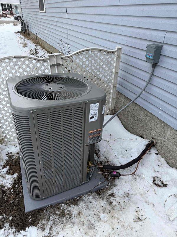 Successfully installed a complete Lennox HVAC system, including a 15.5 SEER, 97% efficiency furnace in customer's utility area with proper PVC venting. Outdoor condenser unit was placed on concrete pad with appropriate electrical connections and insulated refrigerant lines running to the indoor unit.