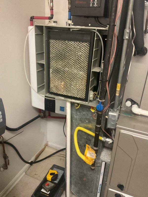 Responded to customer complaint of loud noise during system startup in 1-year-old HVAC unit. Inspected blower assembly and discovered loose fan mounting hardware causing vibration during operation. Tightened all fasteners on the blower motor and fan assembly, checked electrical connections, and verified proper operation of thermostat controls. System now operating normally with noise issue eliminated.